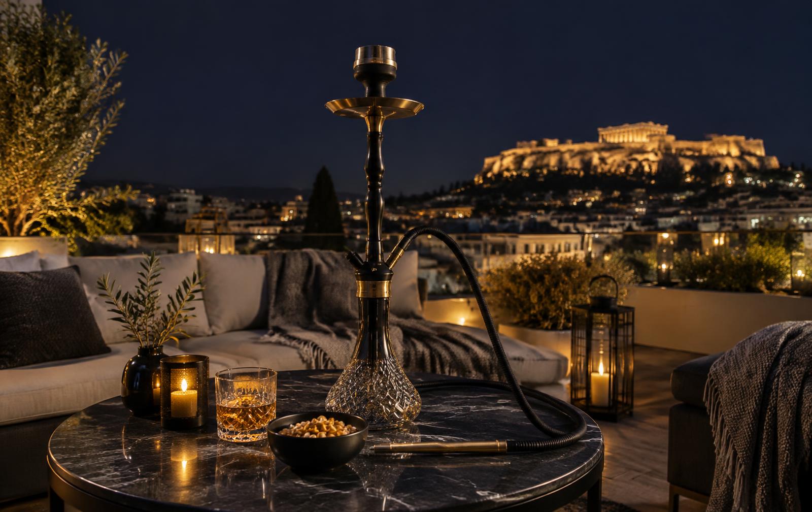 Hookah set up on an Athens rooftop terrace at night with the Acropolis lit up